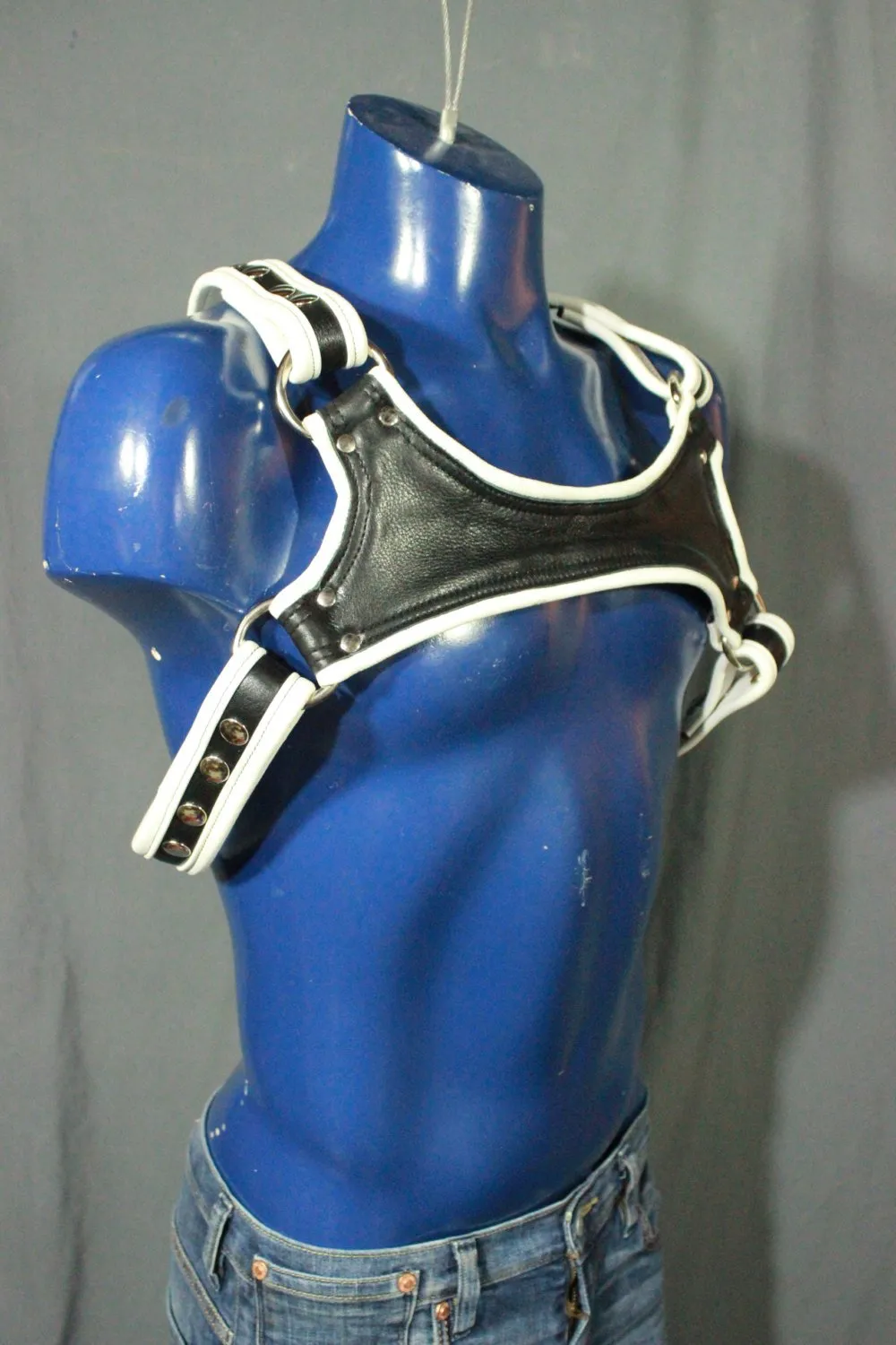 Black and white leather harness with keystone highlight.